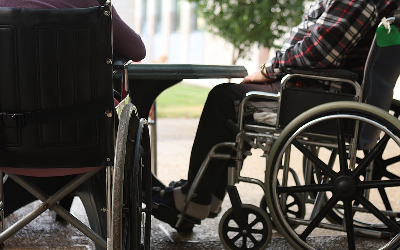 Nursing home residents gather outside a facility. (Yakov Stavchansky/Dreamstime/TNS)