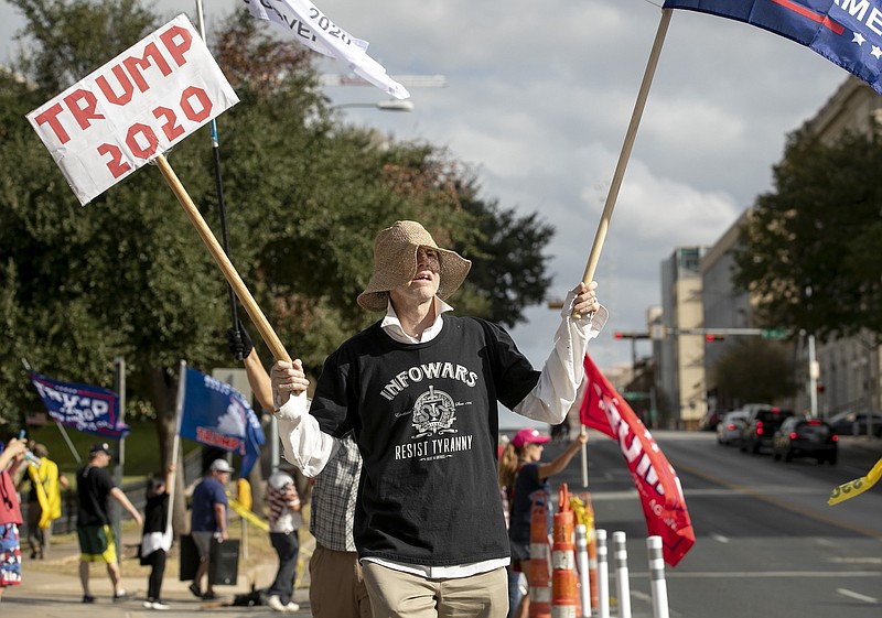 Photo by Jay Janner of the Austin American-Statesman via The Associated PRess / A supporter of President Trump protests the results of the election at the capitol in Austin, Texas, on Saturday, Nov. 21, 2020.