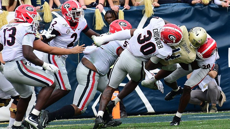 Georgia photo by Perry McIntyre / Georgia's defense was unrelenting in last year's 52-7 win at Georgia Tech, but the Bulldogs and Yellow Jackets are not playing this season for the first time since 1924 due to the COVID-19 pandemic.