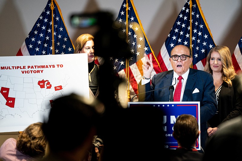 Photo by Erin Schaff of The New York Times / Rudy Giuliani, President Donald Trump's personal lawyer, addresses a news conference at Republican National Committee headquarters in Washington on Nov. 19, 2020.