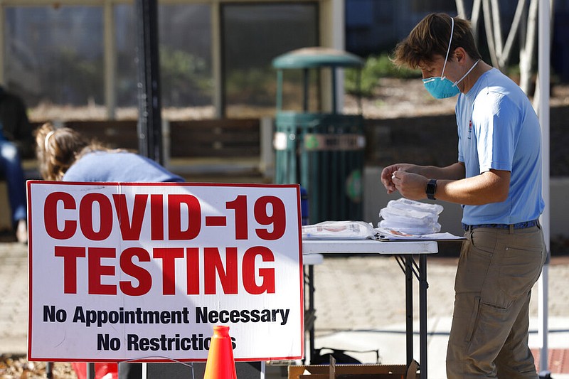 Athens-Clarke County Health Department staff get ready for COVID-19 testing at the free Downtown Health Fair on Wednesday, Nov. 18, 2020, in Athens, Ga. (Joshua L. Jones/Athens Banner-Herald via AP)