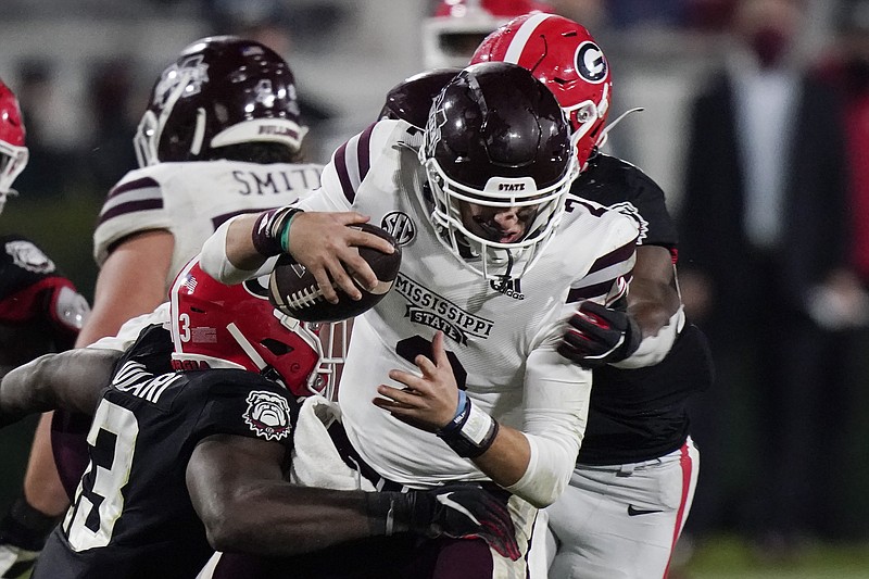 AP photo by Brynn Anderson / Georgia linebacker Azeez Ojulari, left, and a teammate sack Mississippi State quarterback Will Rogers during the second half of last Saturday's matchup of the SEC's two bunches of Bulldogs in Athens, Ga.