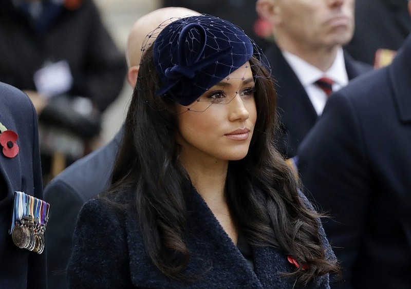 FILE - In this Thursday, Nov. 7, 2019 file photo Meghan the Duchess of Sussex stands after she and her husband Britain's Prince Harry placed a Cross of Remembrance as they attend the official opening of the annual Field of Remembrance at Westminster Abbey in London. The Duchess of Sussex has revealed that she had a miscarriage in July. Meghan described the experience in an opinion piece in the New York Times on Wednesday. She wrote: "I knew, as I clutched my firstborn child, that I was losing my second." The former Meghan Markle and husband Prince Harry have a son, Archie, born in 2019. (AP Photo/Matt Dunham, File)


