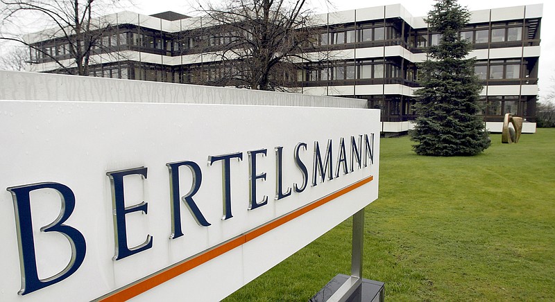 This March 13, 2003 file photo shows an exterior view of the German media giant Bertelsmann in Guetersloh, Germany. German media giant Bertelsmann said Wednesday that it is buying publisher Simon & Schuster from ViacomCBS for $2.17 billion in cash. (AP Photo/Michael Sohn, file)