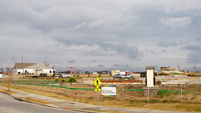 Staff photo by C.B. Schmelter / The recently rebuilt Grace Children's Center, left, will reopen Monday after Easter storms devastated the campus. The rest of the Grace Academy campus, seen the right of the center, and is still a scene devastation.