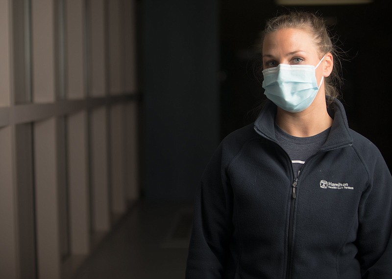 Staff photo by Troy Stolt / Brea Johnson, an RN  in the Medical Intensive Care Unit at Hamilton Medical Center is photographed at the end of her shift on Friday, Nov. 20, 2020 in Dalton, Georgia. "When we go home, because we've seen so many poor outcomes, the first thing we think of as a nurse is what could we have done differently" Johnson said of treating COVID-19 patients in Whitfield County "right now we just don't know." 