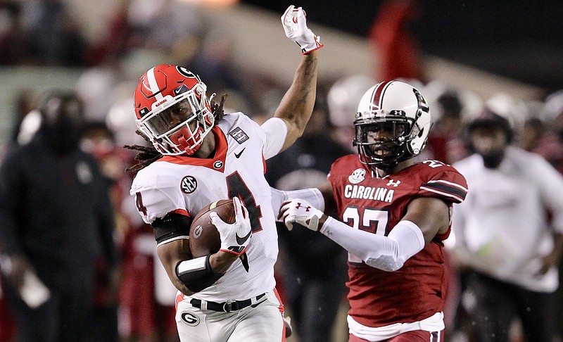 Photo by Travis Bell / Georgia junior running back James Cook had 104 yards on only six carries during Saturday night's 45-16 drubbing of South Carolina inside Williams-Brice Stadium.