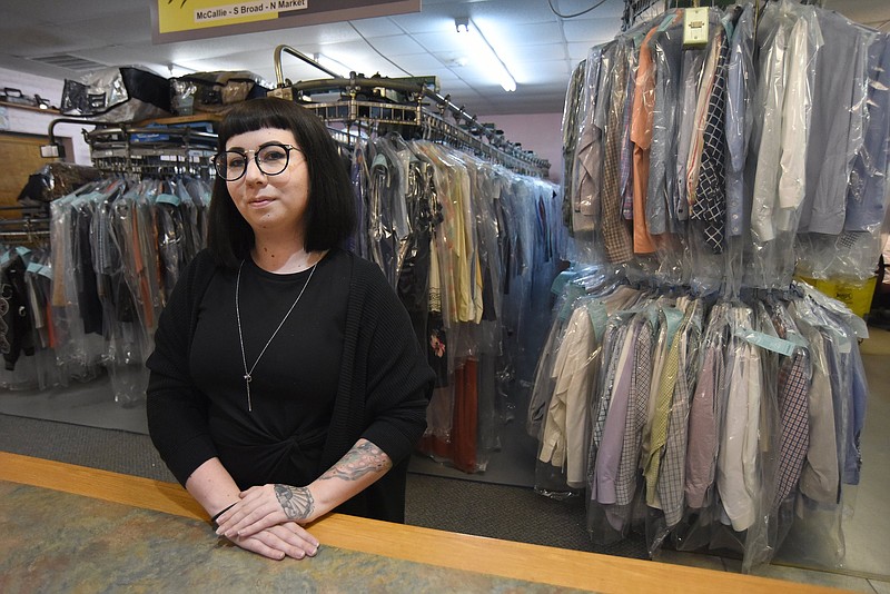 Staff Photo by Matt Hamilton / Gordon's Cleaners co-owner Tabitha Gass stands at the counter of the North Chattanooga location of the 68-year-old business, which has seen demand drop by 58% this year.