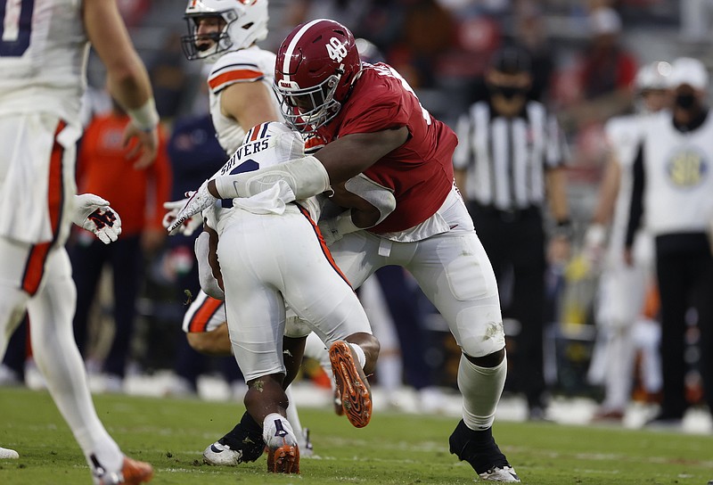 Crimson Tide photos / Shaun Shivers and Auburn's other running backs had little room to roam last Saturday against Phidarian Mathis and the Alabama defense.