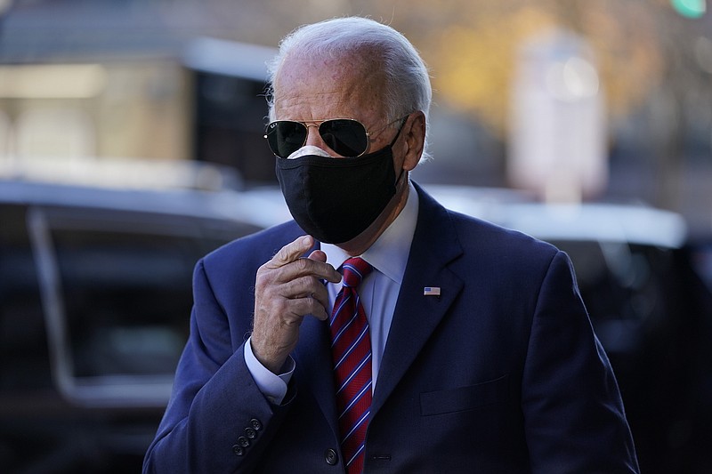 Photo by Carolyn Kaster of The Associated Press / In this Nov. 23, 2020, file photo, President-elect Joe Biden walks from his motorcade to speak to members of the media in Wilmington, Delaware.