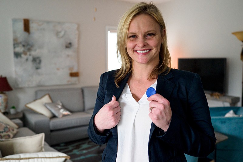 Staff photo by C.B. Schmelter / Ashley Harrison poses with her 6-month chip at The Launch Pad on Monday, Nov. 30, 2020 in Chattanooga, Tenn. The Launch Pad is a sober living home for women founded by local restaurateur Scottie Bowman.