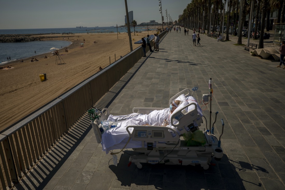Francisco Espana looks at the Mediterranean sea from a promenade next to the Hospital del Mar in Barcelona, Spain, on Sept. 4, 2020. After 52 days in the hospital’s intensive care unit due to the coronavirus, Francisco was allowed by his doctors to spend almost ten minutes at the seaside as part of his recovery therapy. (AP Photo/Emilio Morenatti)