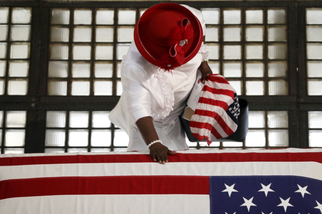 Ga Breedlove pauses by the casket of Rep. John Lewis lying in repose at the Georgia State Capitol in Atlanta on July 29, 2020. Lewis, who carried the struggle against racial discrimination from Southern battlegrounds of the 1960s to the halls of Congress, died on July 17, 2020. (AP Photo/Brynn Anderson)