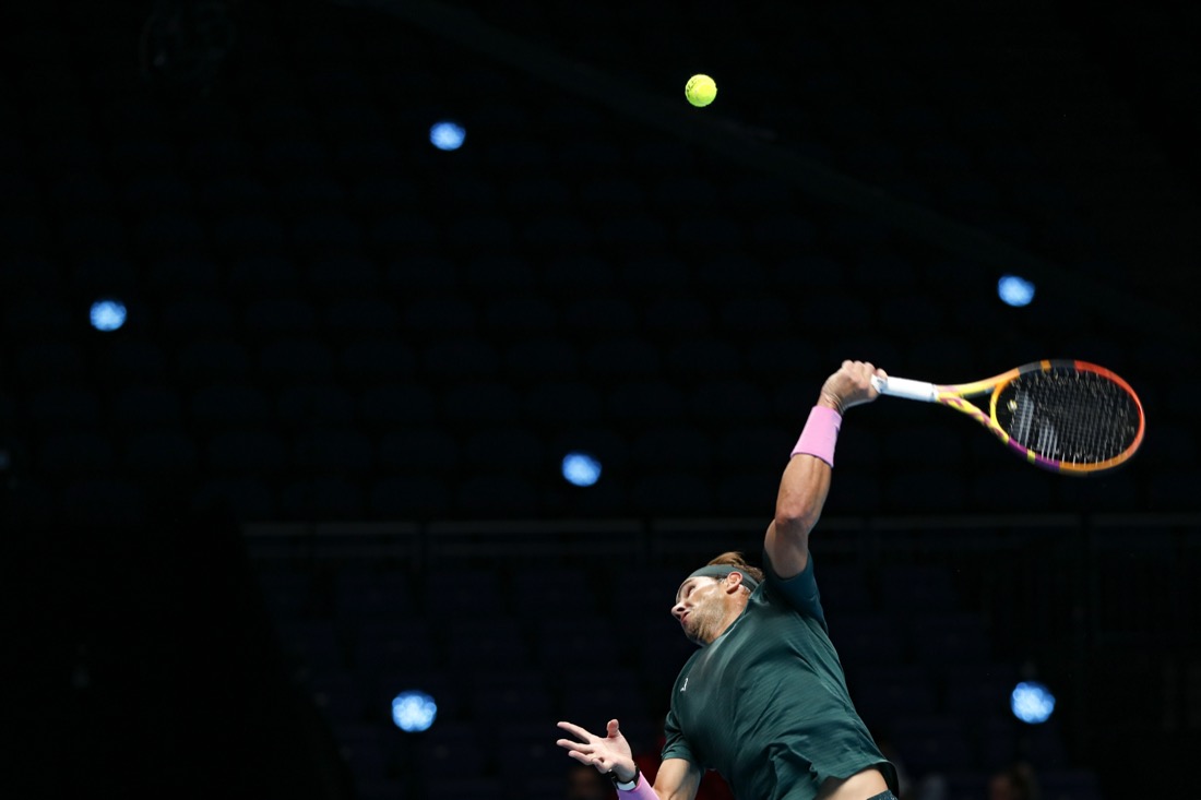 Rafael Nadal of Spain serves to Stefanos Tsitsipas of Greece during their tennis match at the ATP World Finals tennis tournament at the O2 arena in London on Nov. 19, 2020. (AP Photo/Frank Augstein)