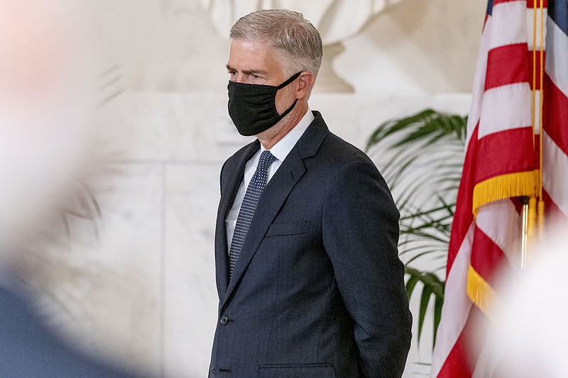 Photo by Andrew Harnik of The Associated Press, Pool / Justice Neil Gorsuch is shown at a private ceremony for Justice Ruth Bader Ginsburg at the Supreme Court in Washington on Wednesday, Sept. 23, 2020.