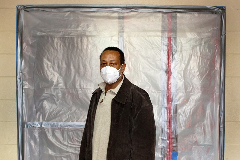 Staff photo by Wyatt Massey / Robert Arnold, business administrator for the Salvation Army, stands in front of a plastic-sealed entryway in the Salvation Army building on McCallie Avenue on Dec. 1, 2020. The church space was converted earlier this year into a quarantine space for people who tested positive for COVID-19 but do not otherwise have a place to stay.