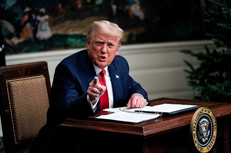 Photo by Erin Schaff of The New York Times / President Donald Trump speaks to reporters in the Diplomatic Reception Room of the White House in Washington, on Nov. 26, 2020.