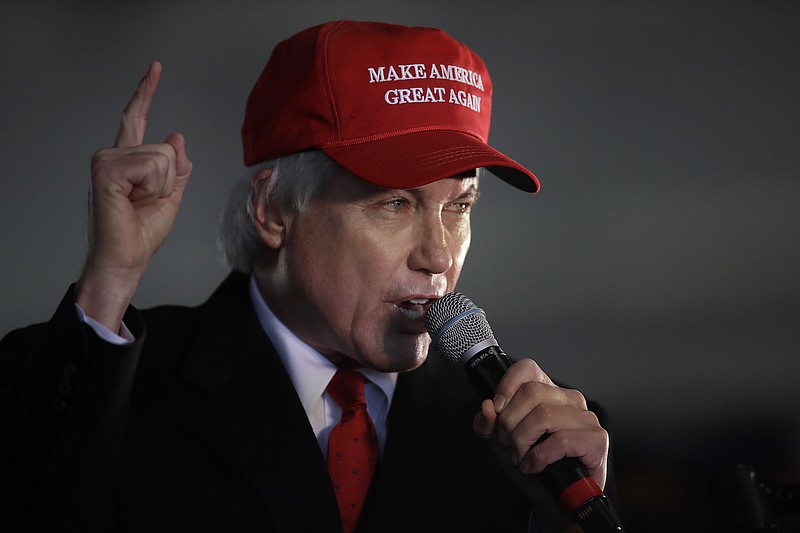 Photo by Ben Margot of The Associated Press /Attorney Lin Wood, a member of President Donald Trump's legal team, gestures while speaking during a rally on Wednesday, Dec. 2, 2020, in Alpharetta, Georgia.