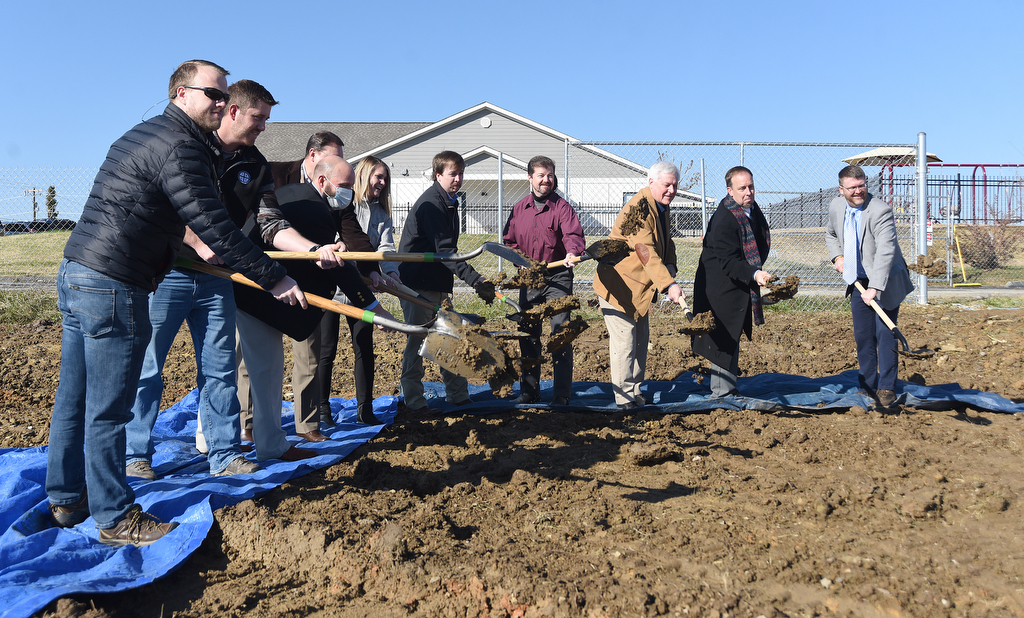 Staff Photo by Matt Hamilton / Leaders of the Grace Baptist Church and Academy in East Brainerd, including from right Pastor Adam Love, Head of School Matt Pollock and school board chairman Tom Crum, shovel dirt during a groundbreaking ceremony Saturday to mark the start of construction on a replacement church and school.