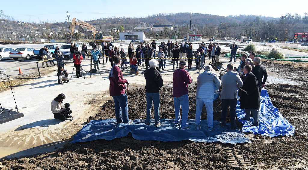 Staff Photo by Matt Hamilton / Those involved with the project participate in the groundbreaking ceremony at the former site of Grace Academy School on Saturday, Dec. 5, 2020.