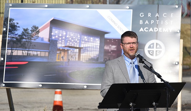 Staff Photo by Matt Hamilton / Grace Baptist Church Pastor Adam Love speaks during a groundbreaking ceremony Saturday for a new church and K-12 school to be built at Shallowford and Jenkins Roads where a tornado demolished the former Grace Baptist Church and Academy in April.