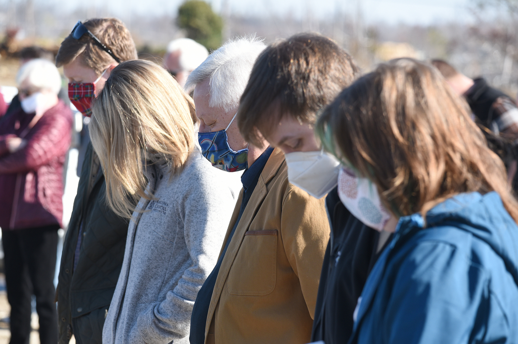 Staff Photo by Matt Hamilton / Supporters bow their heads in prayer during a groundbreaking ceremony at the former site of Grace Academy School on Saturday, Dec. 5, 2020.