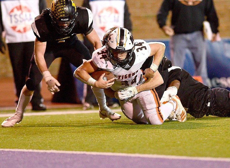 Staff photo by Robin Rudd / After a long run, Meigs County running back Will Meadows is brought down just short of the goal line by a Peabody defender during the TSSAA Class 2A BlueCross Bowl on Saturday at Tennessee Tech.