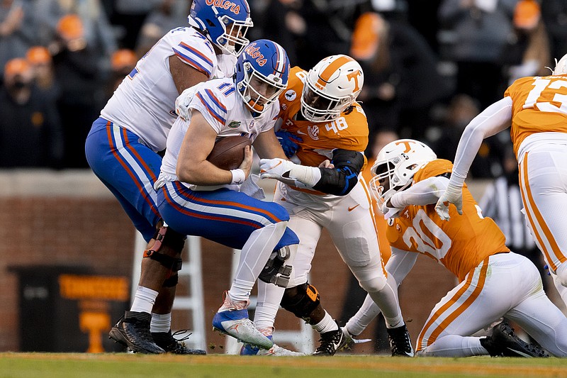 Tennessee Athletics photo by Andrew Ferguson / Tennessee defensive lineman Ja'Quain Blakely (48) tackles Florida quarterback Kyle Trask during Saturday's game in Knoxville. The Gators, who visited Neyland Stadium in December for the first time, won 31-19 and clinched the SEC East title.