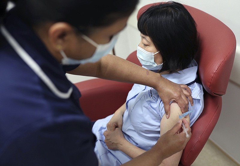 Nurses at the Royal Free Hospital, London, simulate the administration of the Pfizer vaccine to support staff training ahead of the rollout, in London, Friday Dec. 4, 2020. (Yui Mok/Pool Photo via AP)