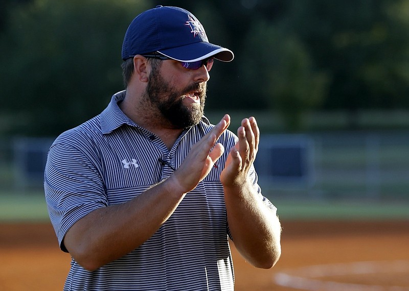 Staff photo by C.B. Schmelter / 
Coach Tanner Moore claps before the bottom of the fourth inning against Central-Carroll during the first game of a GHSA Class AAAA second round state playoff doubleheader at Heritage High School on Wednesday, Oct. 17, 2018 in Ringgold, Ga.