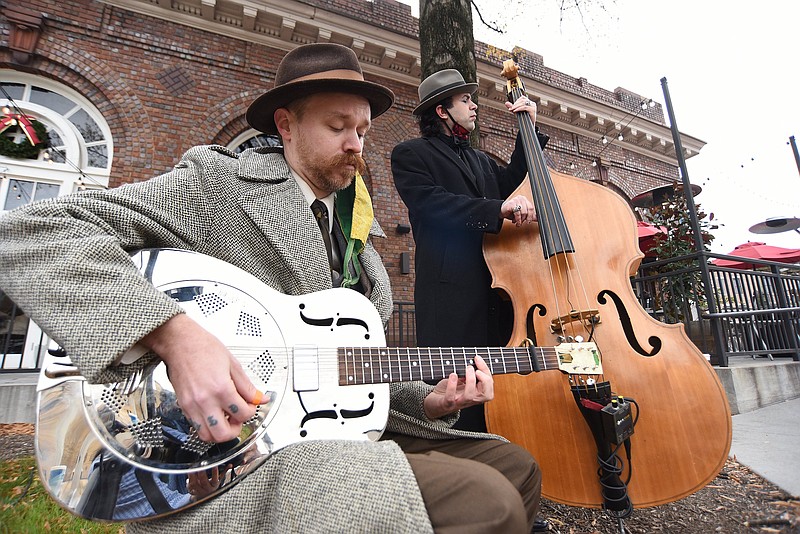 Staff Photo by Matt Hamilton / Lon Eldridge, front, and Skip Frontz, Jr. perform with The 9th Street Stompers on Monday during an unveiling of a Tennessee Music Pathways marker in front of the Chattanooga Choo Choo.