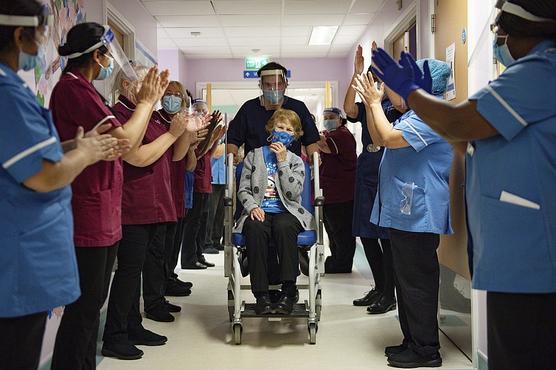 AP photo by Jacob King/Margaret Keenan, 90, is applauded by staff as she returns to her ward after becoming the first patient in the UK to receive the Pfizer-BioNTech COVID-19 vaccine, at University Hospital, Coventry, England on Tuesday.