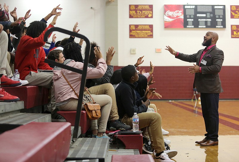 Staff photo by Erin O. Smith / LaDarius Price speaks with Howard School students during a health care career fair held at the school Thursday, November 7, 2019 in Chattanooga, Tennessee.