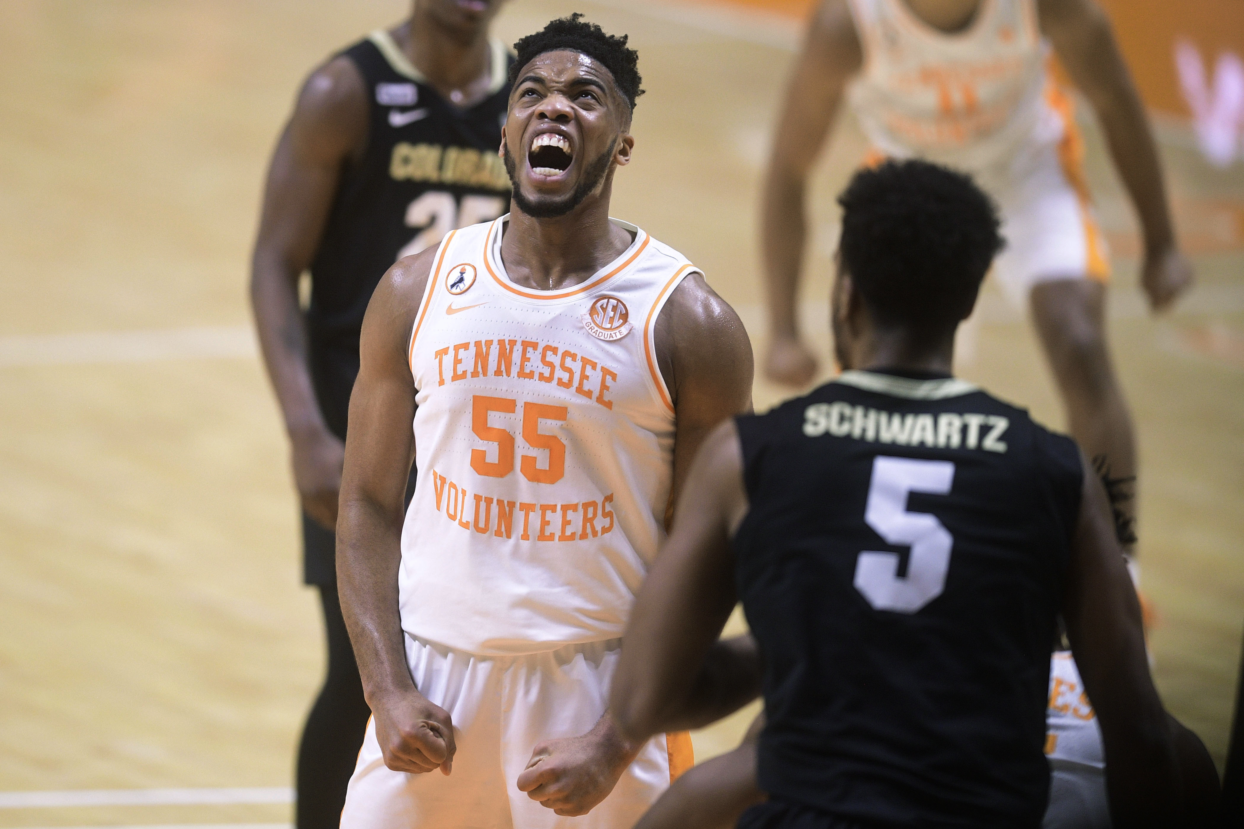 Tennessee's E.J. Anosike (55) reacts after making a basket against Colorado during the second half of an NCAA college basketball game Tuesday, Dec. 8, 2020, in Knoxville, Tenn. (Caitie McMekin/Knoxville New-Sentinel via AP, Pool)