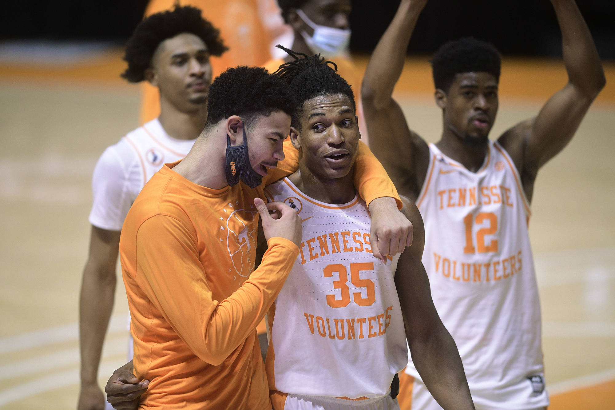Tennessee's Oliver Nkamhoua, left, and Yves Pons (35) celebrate after Tennessee defeated Colorado in an NCAA college basketball game Tuesday, Dec. 8, 2020, in Knoxville, Tenn. (Caitie McMekin/Knoxville New-Sentinel via AP, Pool)
