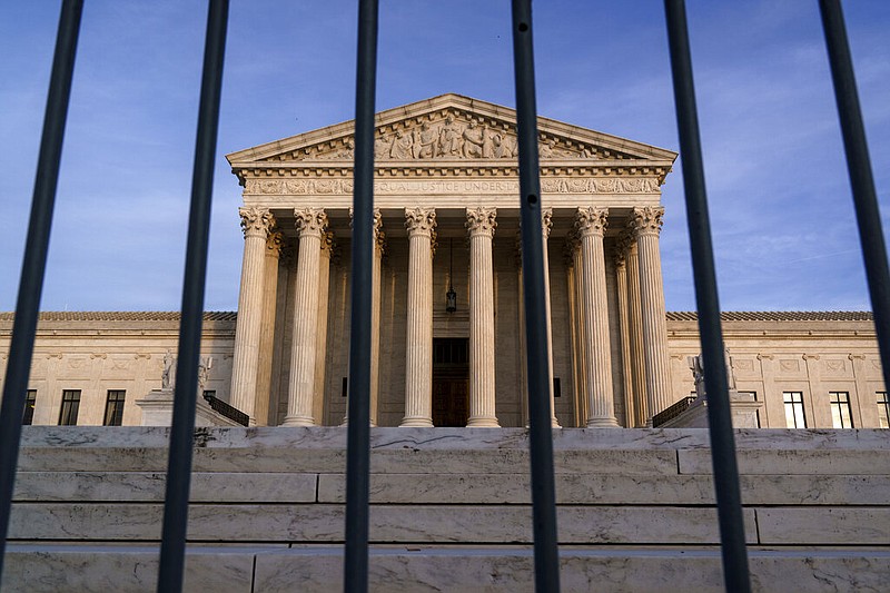 In this Nov. 5, 2020, file photo, the Supreme Court in Washington. The Supreme Court has rejected Republicans' last-gasp bid to reverse Pennsylvania's certification of President-elect Joe Biden's victory in the electoral battleground. The court without comment Tuesday, Dec. 8, refused to call into question the certification process in Pennsylvania. (AP Photo/J. Scott Applewhite)