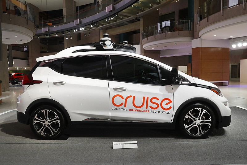 FILE - In this Jan. 16, 2019, file photo, Cruise AV, General Motor's autonomous electric Bolt EV is displayed in Detroit. General Motors' self-driving car company is sending vehicles without anybody behind the wheel in San Francisco as it navigates its way toward launching a robotic taxi service that would compete against Uber and Lyft in the hometown of the leading ride-hailing services. The move announced Wednesday, Dec. 9, 2020, by GM-owned Cruise come two months after the company received California's permission to fully driverless cars in the state. (AP Photo/Paul Sancya, File)