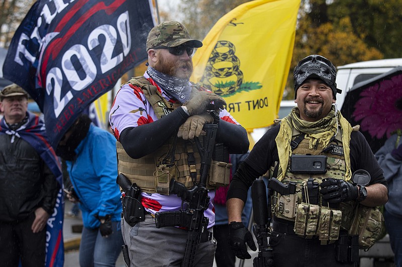 Photo by Paula Bronstein of The Associated Press / Armed supporters of President Donald Trump attend a "Stop The Steal" rally at the Oregon State Capitol to protest he outcome of the election on Saturday, Nov. 14, 2020 in Salem, Oregon.