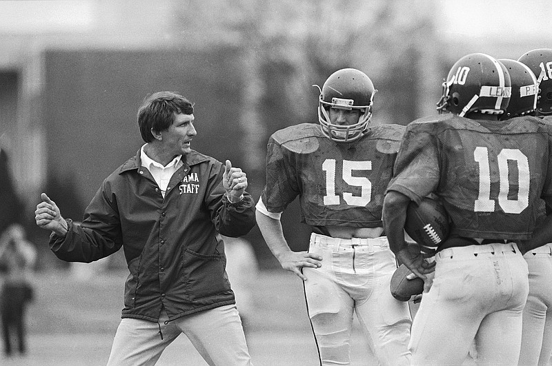 AP photo / University of Alabama football coach Ray Perkins explains techniques to his quarterbacks during a spring practice on March 23, 1983, in Tuscaloosa, Ala. Perkins, a former Crimson Tide star receiver who returned to Alabama as Bear Bryant's successor and led the team for four seasons, died Wednesday. He was 79.