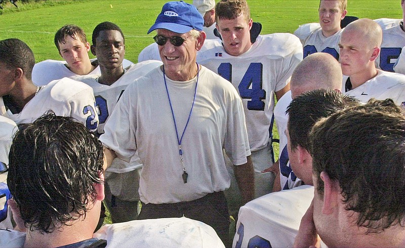 Staff photo / Red Bank football coach Tom Weathers talks to players during a preseason practice in 2001. Weathers, who coached the Lions to more than 200 wins and an undefeated state championship run in 29 seasons leading the program, died Wednesday. He was 80.