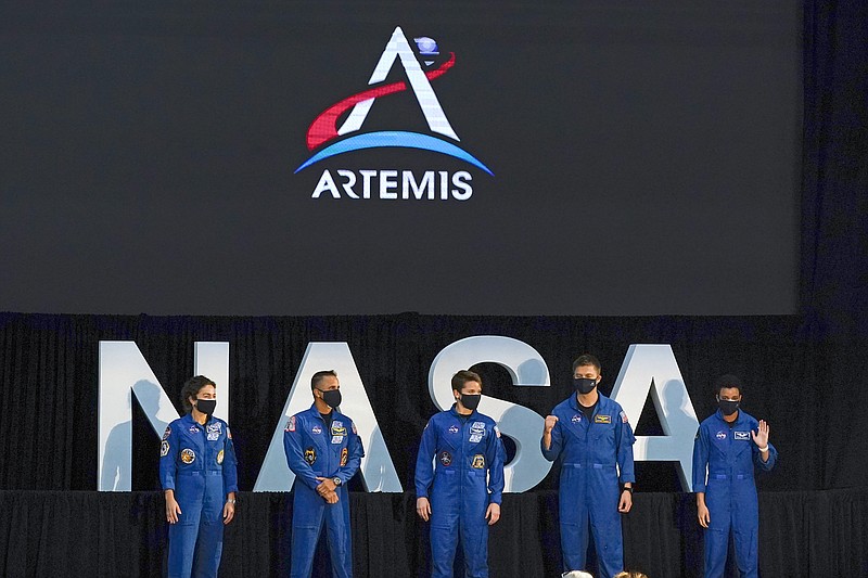 Five of the astronauts that will be part of the Atremis missions, from left, Jessica Meir, Joe Acaba, Anne McClain, Matthew Dominick, and Jessica Watkins are introduced by Vice President Mike Pence during the eighth meeting of the National Space Council at the Kennedy Space Center Wednesday, Dec. 9, 2020, in Cape Canaveral , Fla. (AP Photo/John Raoux)
