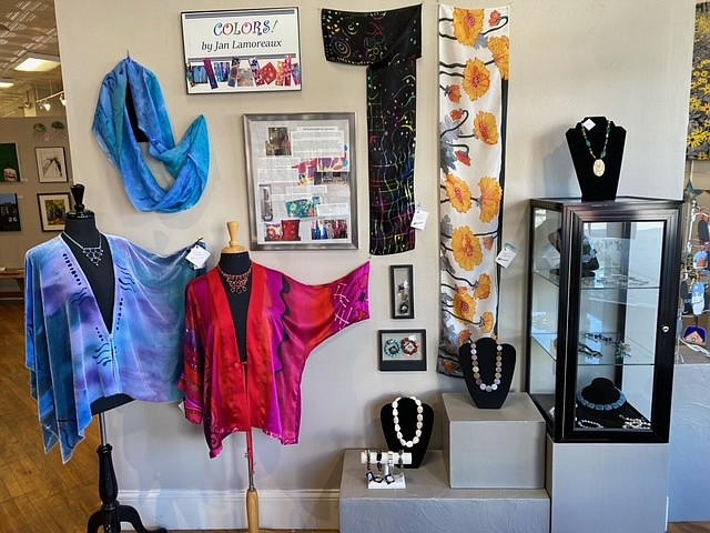 Contributed Photo from Jim Tucker / In-Town Gallery's feature wall this month showcases jewelry by Eleanor Goodson and painted silk by Jan Lamoreaux in a monthlong exhibition titled "Art You Wear."