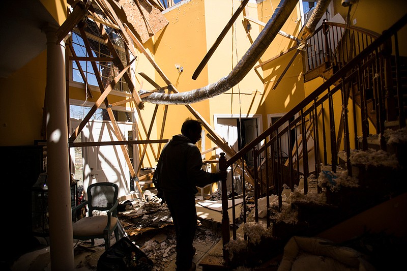 Staff photo by Troy Stolt / "We're just lucky to be alive" says East Brainerd resident Bill Foster as he walks up the stairs of his home on Gallahad Road on Tuesday, April 14, 2020 in East Brainerd, Tenn. Foster and his wife Barbara were laying in bed watching television late Sunday night when he received a call from his son warning that a tornado had just touched down in the Camp Jordan area. Moments after the Fosters found shelter down stairs, their house was torn apart.