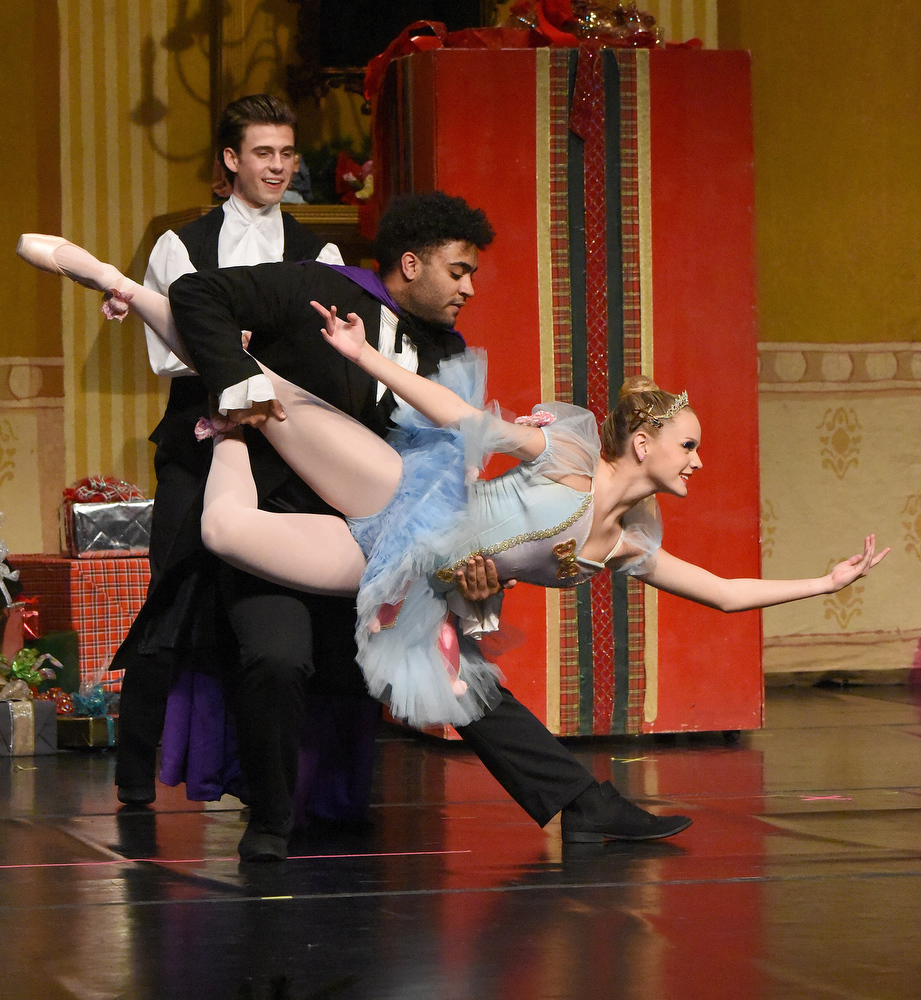 Staff Photo by Matt Hamilton / Christian Owen, back, looks on as Jacob Musto, playing Herr Drosselmeyer, dances with Maddie King, playing the Columbine, during a rehearsal for "The Nutcracker 2020" by The Dance Theatre of Dalton at the Colonnade Center in Ringgold on Wednesday, Dec. 9, 2020. In previous years, the performance was at Dalton High School, but COVID-19 precautions have moved the performance to the Colonnade Center. Tickets are only available to family members but the performances can be viewed at http://daltontoday.com for no charge.