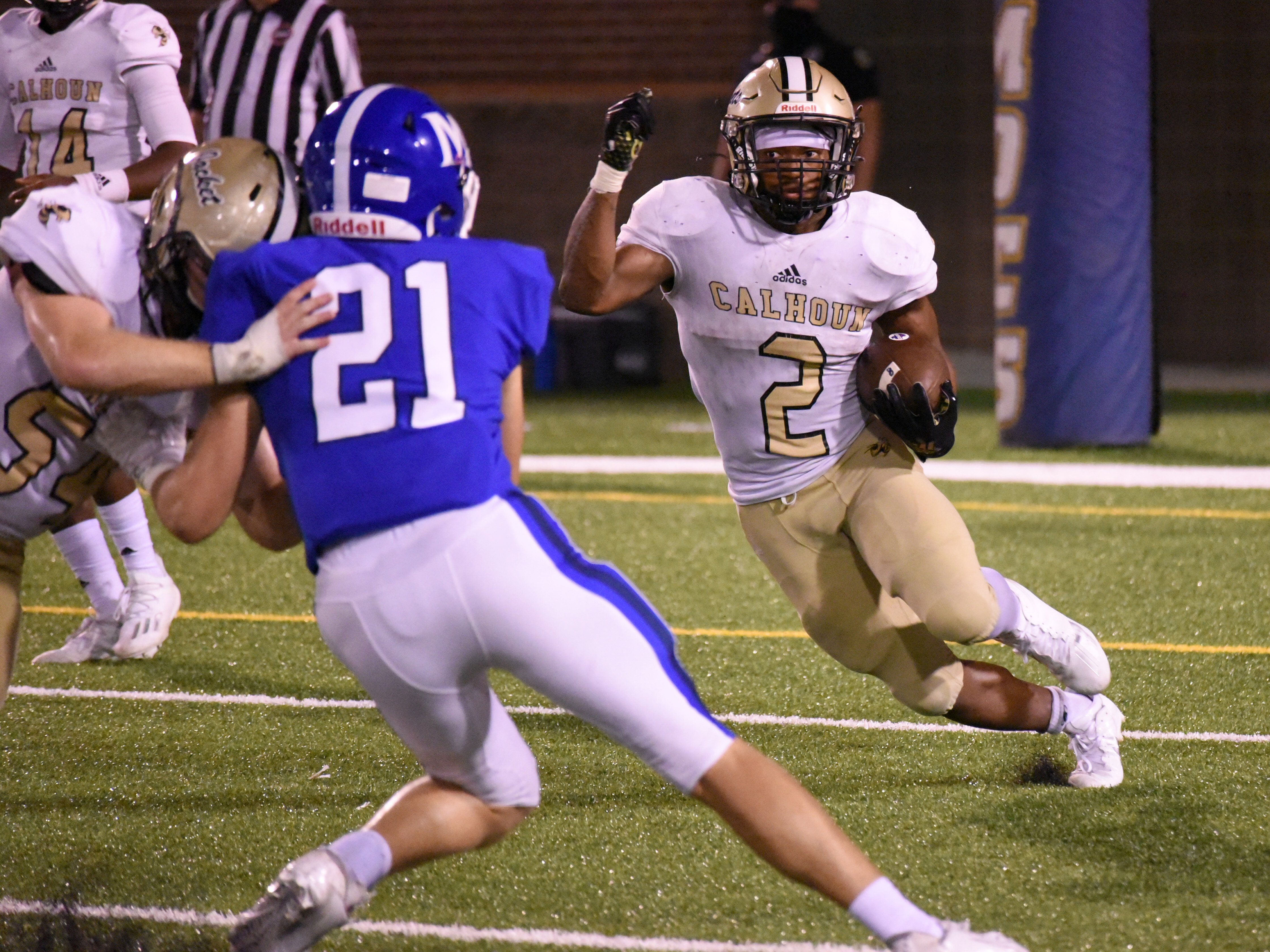 Staff photo by Matt Hamilton / Calhoun running back Jerrian Hames (2) cuts toward a hole opened by the Yellow Jackets' offensive line during a game against McCallie on Sept. 11 at Finley Stadium. Hames, a 5-foot-10, 180-pound senior, has rushed for nearly 3,000 yards combined during his upperclassman seasons and has helped the Jackets (9-3) reach this week's GHSA Class AAAAA quarterfinals for a home game against Coffee (9-2).
