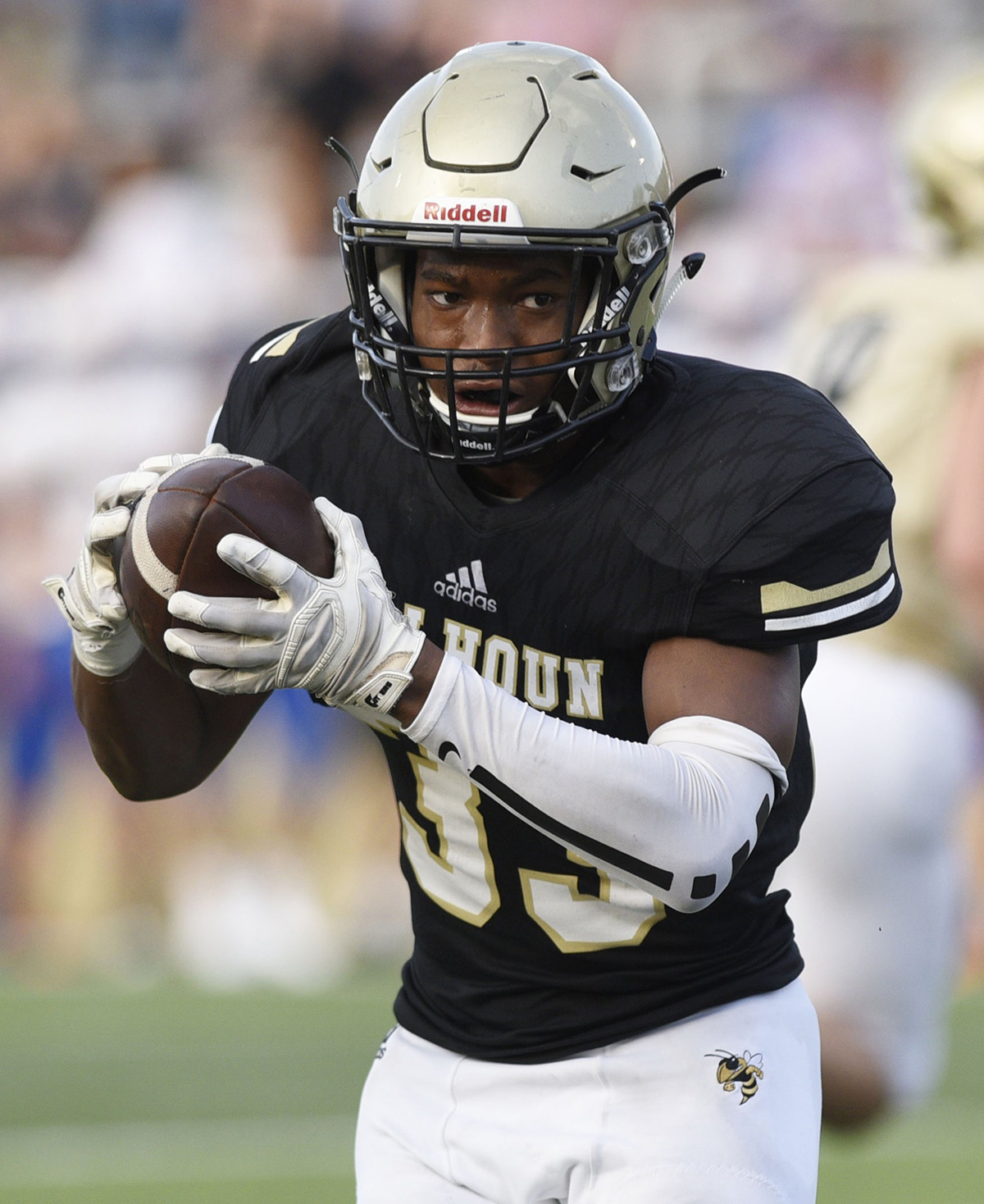 Staff photo by Robin Rudd / Calhoun's Jerrian Hames looks for running room after catching a pass during a scrimmage against Northwest Whitfield on Aug. 9, 2019.
