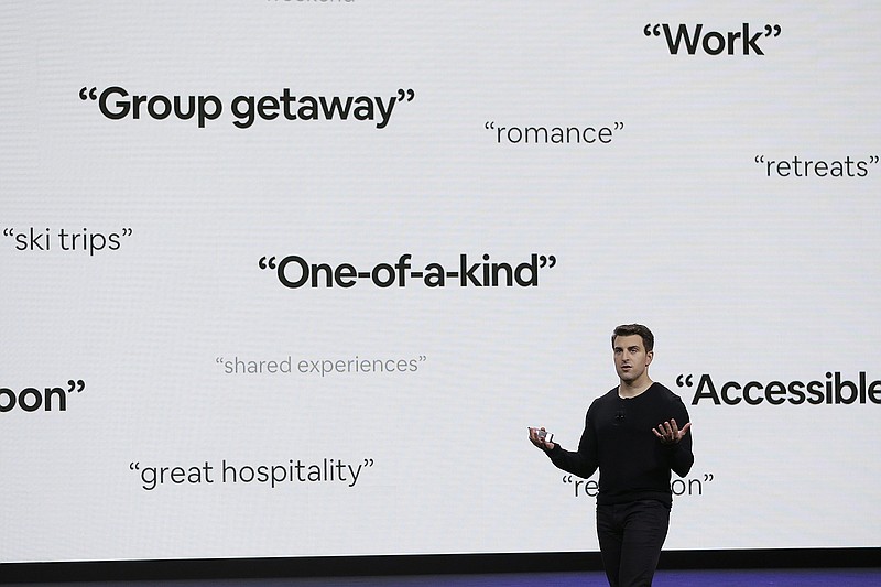 FILE - In this Feb. 22, 2018, file photo, Airbnb co-founder and CEO Brian Chesky speaks during an event in San Francisco. Thirteen years after its founders first rented air mattresses in their San Francisco apartment, Airbnb is making its long-awaited stock market debut. The home sharing company priced its shares at $68 apiece late Wednesday, Dec. 9, 2020 giving it an overall value of $47 billion. Starting Thursday, it will trade on the Nasdaq Stock Market under the symbol "ABNB." (AP Photo/Eric Risberg, File)