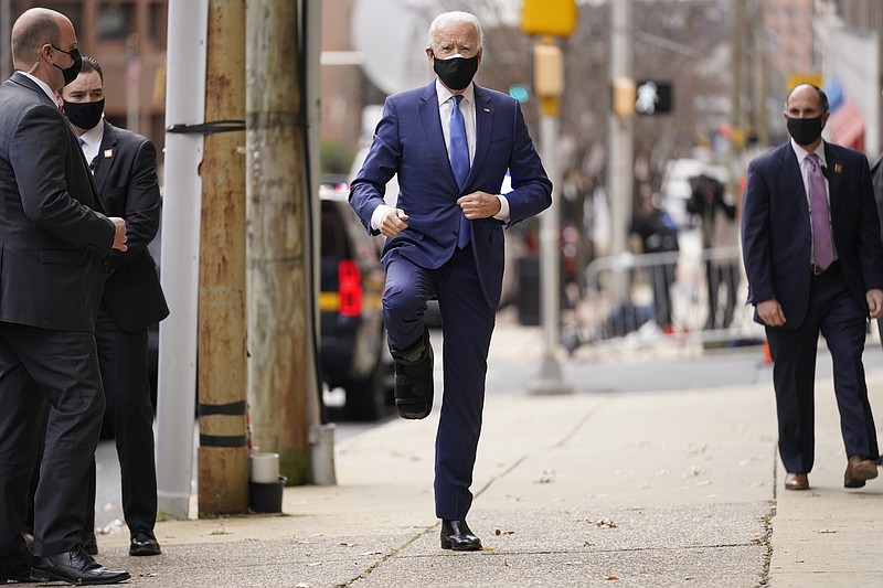 Photo by Andrew Harnik of The Associated Press / President-elect Joe Biden is shown wearing a medical boot as he enters The Queen theater, Tuesday, Dec. 1, 2020, in Wilmington, Delware.