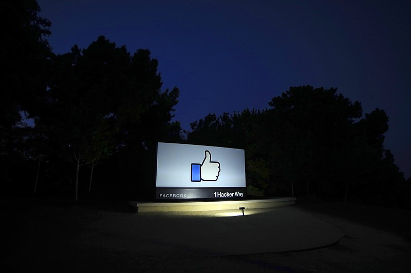 Photo by Jim Wilson of The New York Times / The sign outside Facebook's headquarters in Menlo Park, California, is shown on July 15, 2020. The Federal Trade Commission and 48 states accused Facebook on Dec. 9, 2020, of becoming a social media monopoly by illegally squashing competition by buying up its rivals.