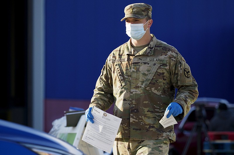 Staff photo by C.B. Schmelter / U.S. Army National Guard 2nd Lt. Richard Sailors welcomes a vehicle at the Alstom COVID-19 testing site on Tuesday, Sept. 22, 2020 in Chattanooga, Tenn.